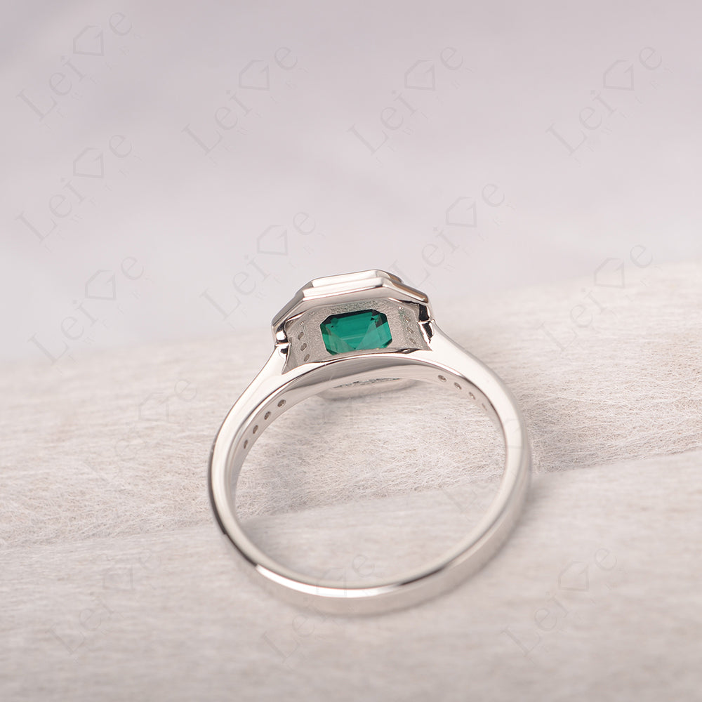 Asscher Cut Emerald Bezel Set Halo Engagement Ring