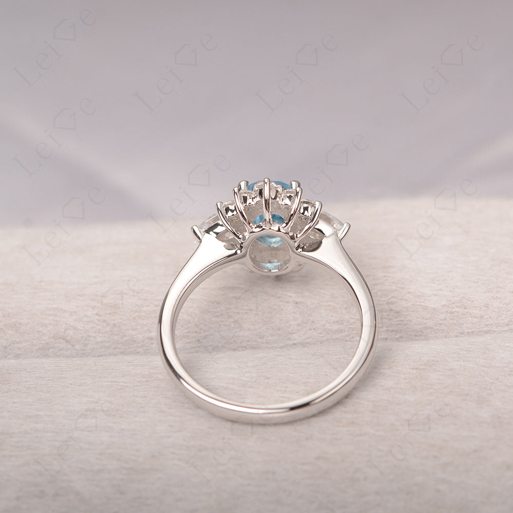 Oval Cut Swiss Blue Topaz Ring With Pear Side Stone